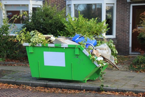 Assessment officer inspecting commercial waste containers onsite