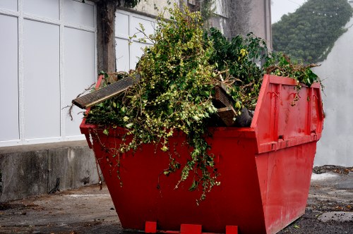 Professional waste clearance team managing construction debris
